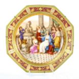 A large Vienna porcelain plate of octagonal form, hand painted Classical temple scene in gilded