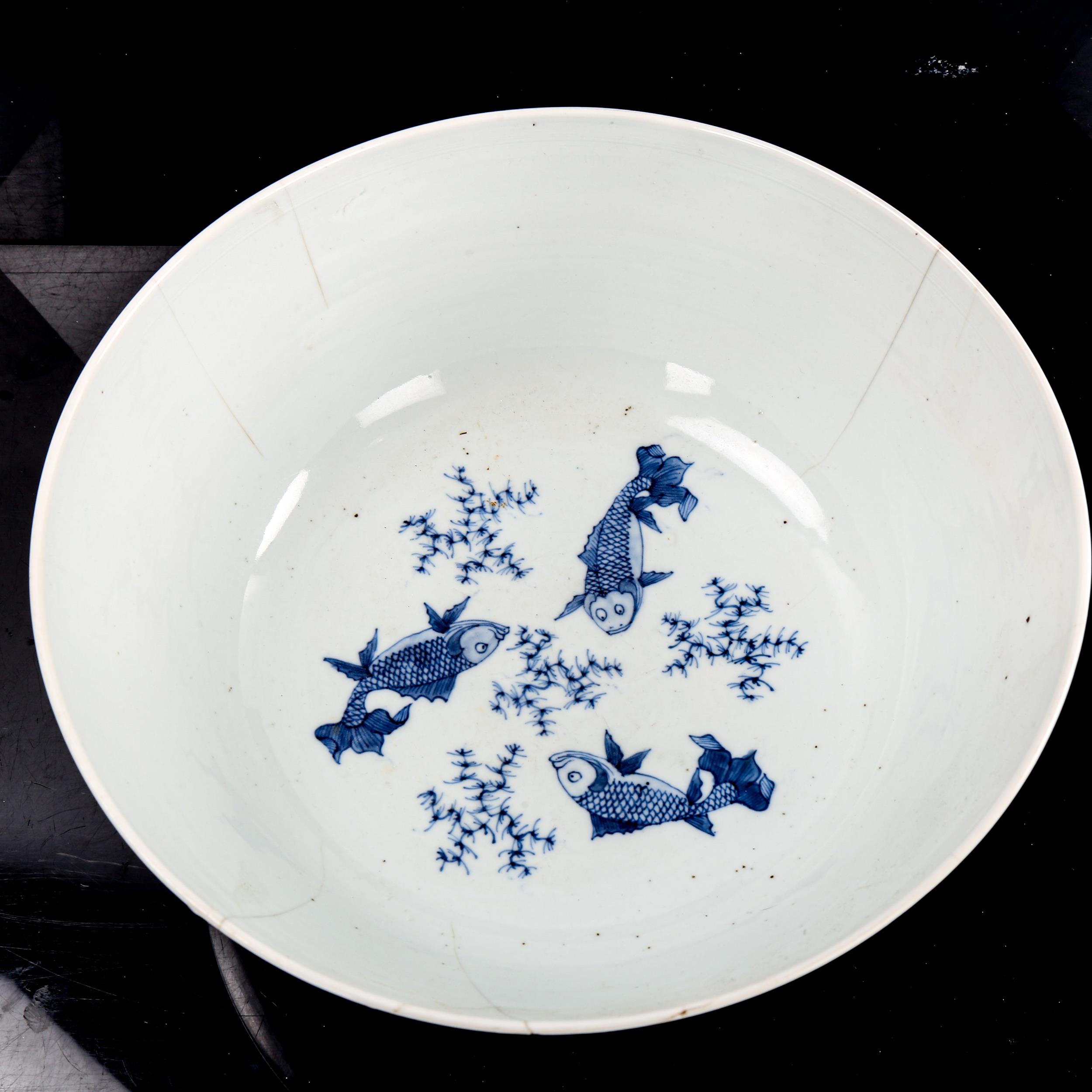 A Chinese blue and white porcelain bowl, painted landscape decoration and carp interior, diameter - Image 2 of 3
