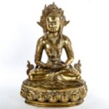 A Chinese polished bronze seated Buddha, height 39cm