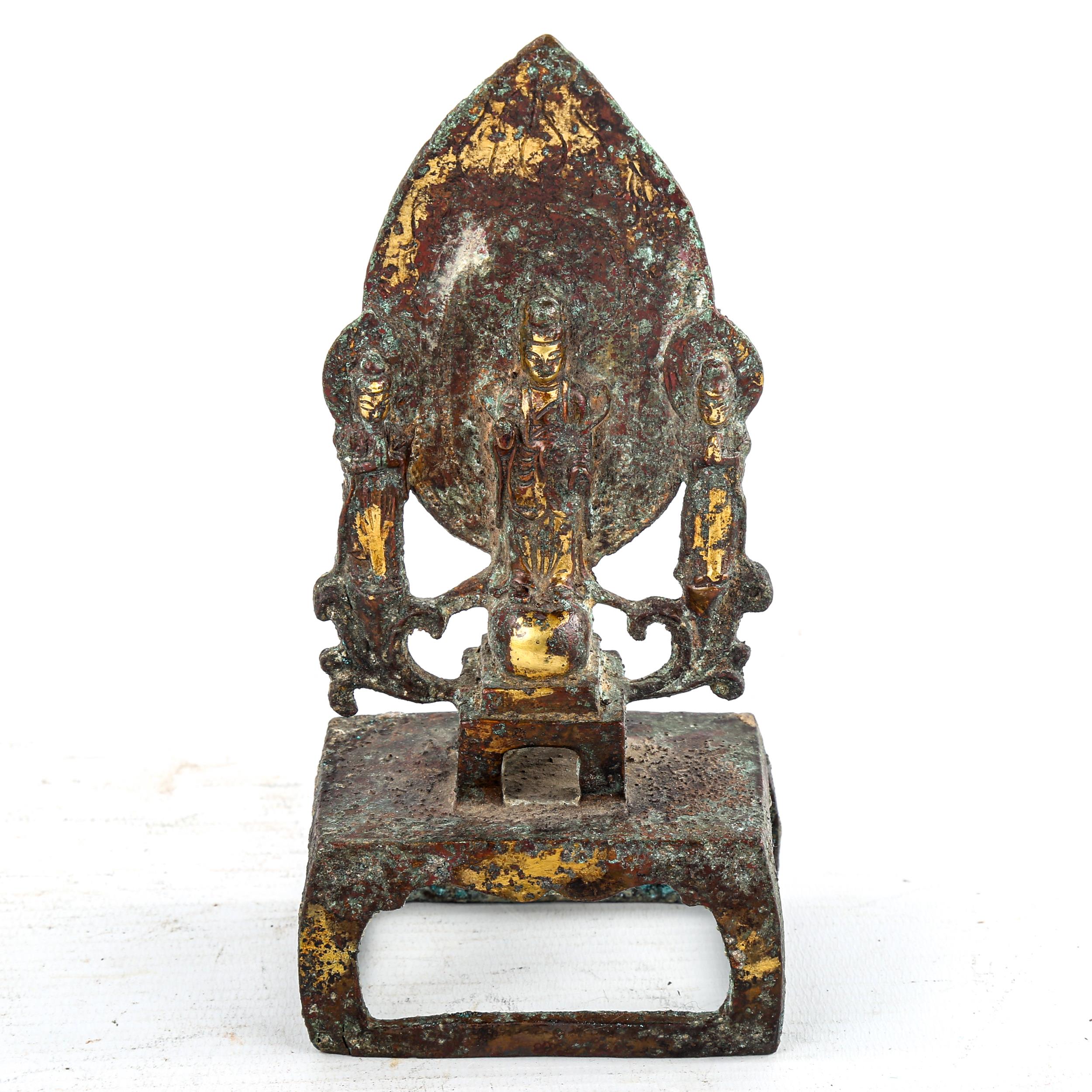 A Chinese verdigris bronze shrine, surmounted by Buddha figures, height 17cm