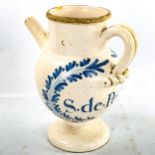 A French tin-glazed pottery drugs ewer, with painted decoration, height 22cm