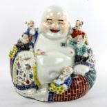 A Chinese porcelain seated Buddha with children, height 26cm, impress mark under base Perfect