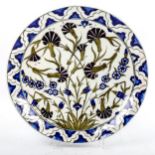 A Turkish pottery plate, with hand painted designs, diameter 33cm Very good condition