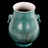 A Chinese mottle green glaze vase with elephant handles, height 19cm Perfect condition
