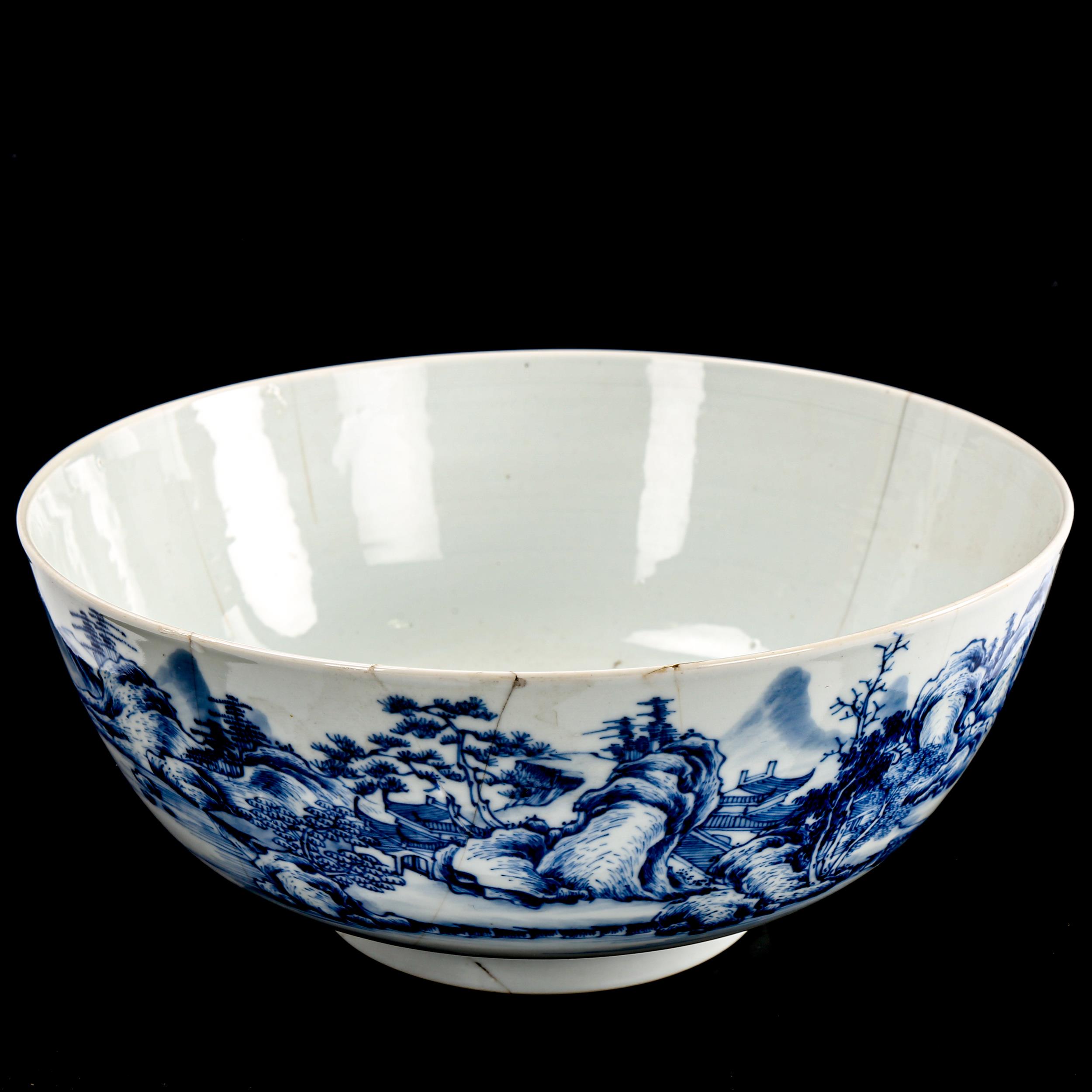 A Chinese blue and white porcelain bowl, painted landscape decoration and carp interior, diameter