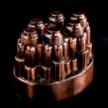 Benham & Froud oval copper jelly mould with 6 turrets, pattern no. 617, height 11cm, length 15.5cm