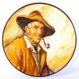 Ismael Monzo (1901 - 1976), hand painted charger, man smoking a pipe, signed, 35cm across Very