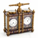 A reproduction champleve enamel and brass-cased double carriage clock and barometer desk