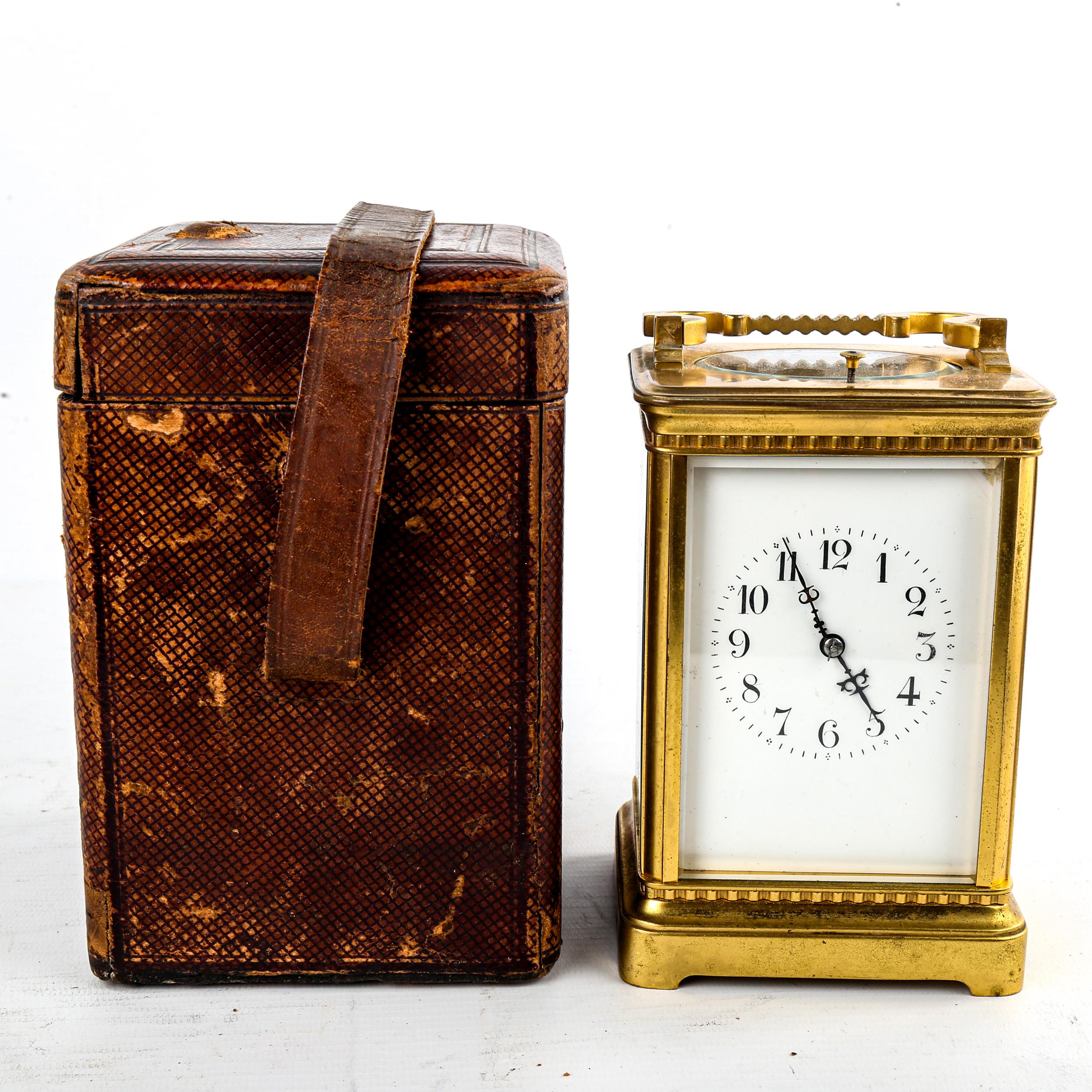 A French oval brass-cased chiming carriage clock, white enamel dial with Roman numeral hour markers, - Image 5 of 5