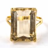 A large Continental unmarked gold citrine dress ring, set with emerald-cut citrine, length 20mm,