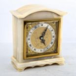 A Vintage polished onyx dome-top mantel clock, by Elliott of London, gilt dial with silvered chapter