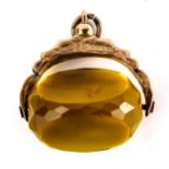 An early 20th century 9ct gold faceted citrine swivel fob, foliate engraved mount, hallmarks Chester