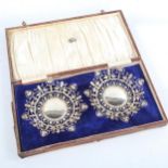 A cased pair of Indian silver dishes, openwork decoration, diameter 14cm, 4.4oz, in Bartons of