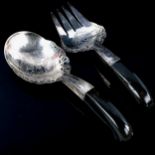 A pair of Middle Eastern unmarked silver horn-handled salad servers, pierced and engraved floral