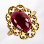 A large late 20th century garnet dress ring, openwork settings with oval cabochon garnet, setting