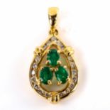 A modern 18ct gold emerald and diamond pear cluster pendant, set with oval mixed-cut emeralds and