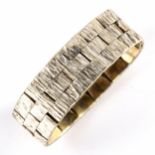 A mid-20th century 9ct white gold articulated brick link ring, textured bark settings, hallmarks