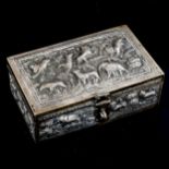 A 19th century Indian silver Paan Daan betel nut box, relief embossed and engraved village scenes