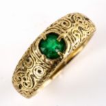 An Antique unmarked high carat gold greenstone gypsy ring, old European-cut stone with ornate