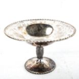 A large Elizabeth II silver pedestal tazza, retailed by Asprey of London, by Albert Edward Jones, in