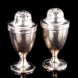 A pair of George III silver baluster pepperettes, indistinct maker's marks, hallmarks London 1797/