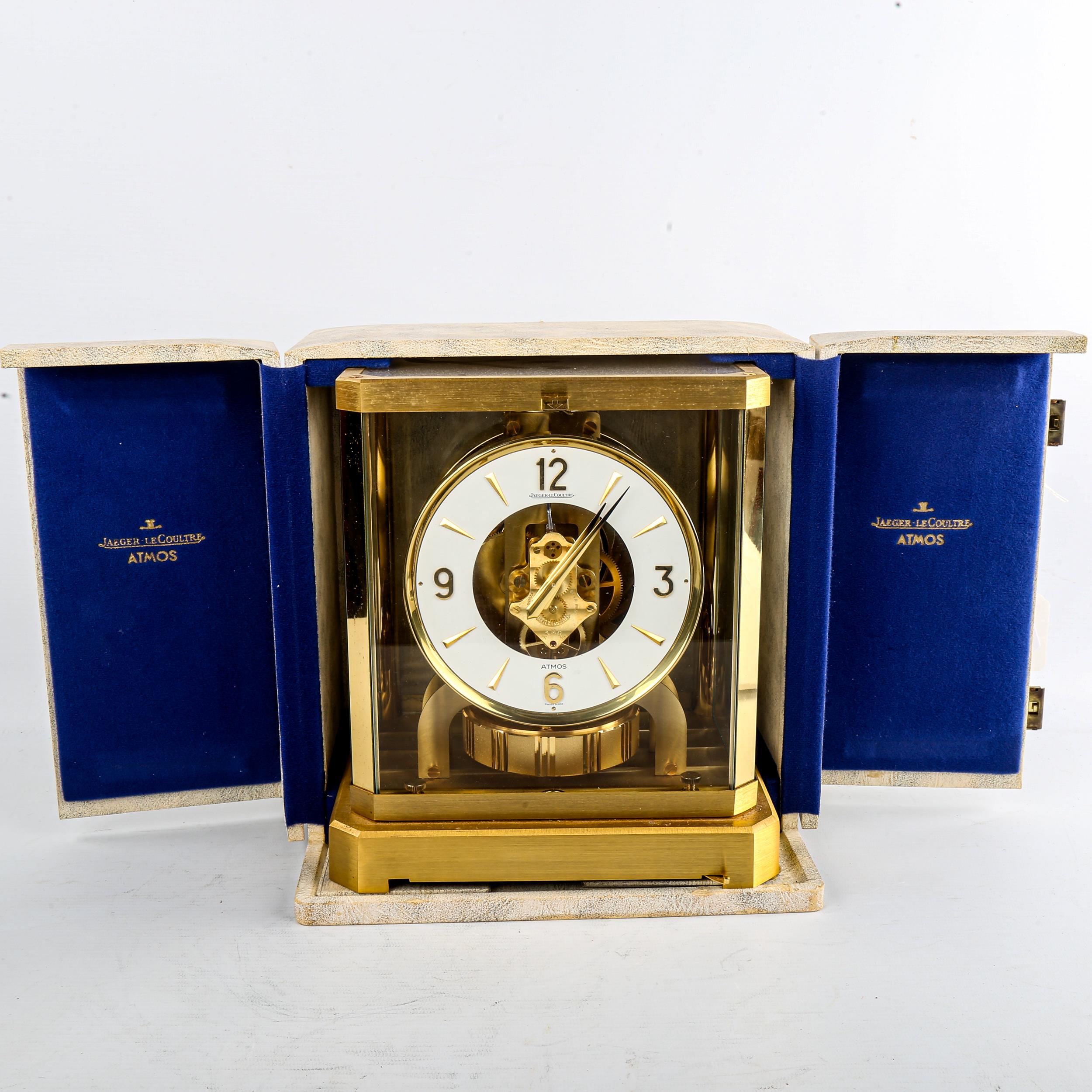 JAEGER LECOULTRE - a Vintage brass-cased Atmos clock, white chapter ring with gilt quarterly