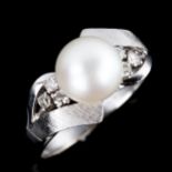 A late 20th century 14ct white gold whole cultured pearl and diamond dress ring, possibly