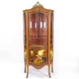 A Continental walnut design? vitrine cabinet of serpentine form, single-glazed door, with shaped