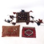 A small Afghan blue ground pillow with shell decorated tassels, a red ground Afghan pillow, and