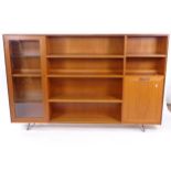 A mid-century teak cabinet, with open shelves and cupboards, L183cm, H117cm, D28cm