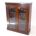 A Victorian mahogany 2-door bookcase, W83cm, H102cm, D30cm