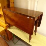 A 19th century mahogany drop leaf dining table, on turned legs, W104cm, H74cm, D45cm