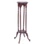 A reproduction hardwood jardiniere stand, with quadruple barley twist columns, on turned leg, W29cm,