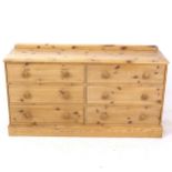 A modern pine 6-drawer chest, on plinth base, L146cm, H81cm, D42cm