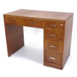 A 1930s Heals oak desk, W99cm, H76cm, D53cm
