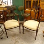 A pair of Antique Hepplewhite style mahogany elbow chairs