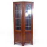 A 1920s mahogany canted corner cabinet, with 2 leadlight glazed doors, W78cm, H169cm, D32cm