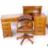 A suite of modern office furniture, comprising a twin-pedestal desk, matching filing cabinet,