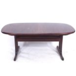 A mid-century Danish rosewood extending dining table, with 2 additional leaves A few marks to top,