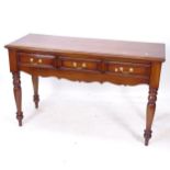 A reproduction mahogany serving table, 3 frieze drawers, raised on baluster turned legs, W146cm,