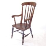 An elm-seated Windsor elbow kitchen chair