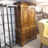 A 19th century Continental oak linen press, fitted with 2 slides, applied moulded cupboard and