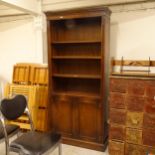 A reproduction mahogany open bookcase, with 3 adjustable shelves and cupboards under, W85cm, H182cm,