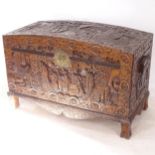 A large Chinese camphorwood blanket chest, with fitted inner tray, and allover relief carved