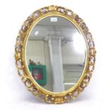 An oval wall mirror, in a pierced and carved acanthus leaf design gilt frame, W53cm, H63cm