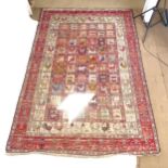 A red ground Soumak rooster's Kilim carpet, 285cm x 197cm