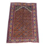 A red ground Beluchi rug, 137cm x 92cm