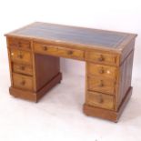 An Edwardian mahogany twin-pedestal writing desk, with fitted drawers, W121cm, H71cm, D61cm,