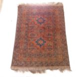 A red ground Persian design rug, 133cm x 103cm