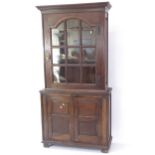 An Antique oak 2-section bookcase, with cupboards under, W100cm, H200cm, D42cm